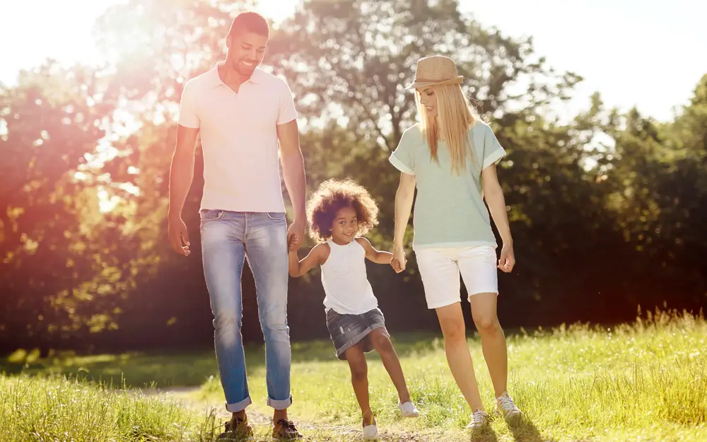 Interracial family walking together